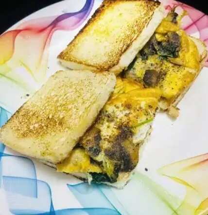 Mushroom, spinach, egg omelette sandwich