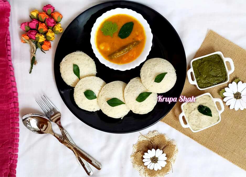 Savoury steamed cake with vegetable lentil stew and savoury Indian sauces