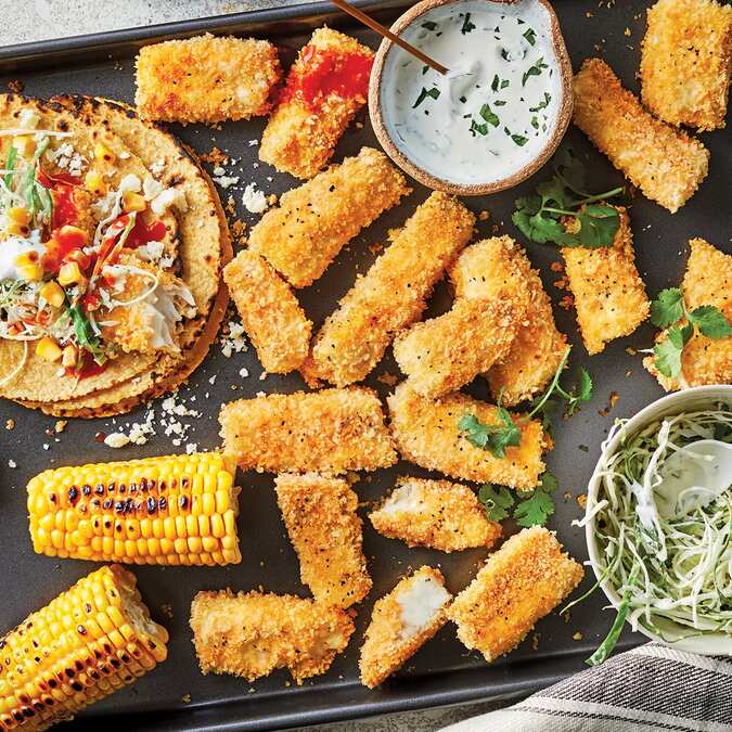 Crispy Fish Tacos With Charred Corn & Crema