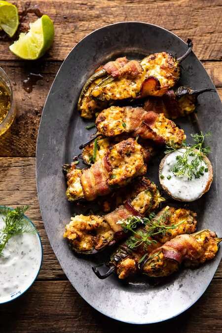 Bacon Wrapped Cheddar Corn Jalapeño Poppers With Cilantro Lime Ranch.