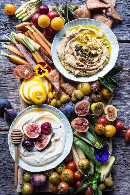 Market Veggie Board With Roasted Corn Jalapeno Hummus + Honey Whipped Goat Cheese.