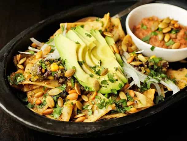 How to make Chilaquiles With Pepitas, Charred Corn, And Black Beans Recipe