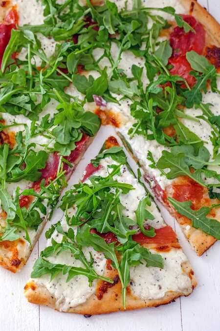 Cracked Pepper Cottage Cheese Pizza with Prosciutto and Arugula