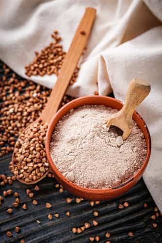 Fresh,Natural,Buckwheat,Flour,On,A,Dark,Wooden,Rustic,Background